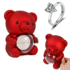 Скринька-ведмідь, що обертається, з трояндою в колбі